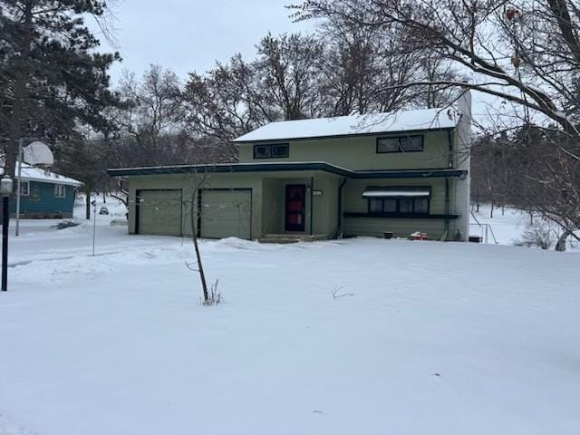 view of snow covered garage