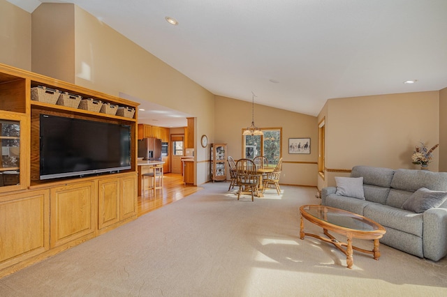 living area with recessed lighting, light colored carpet, baseboards, and lofted ceiling