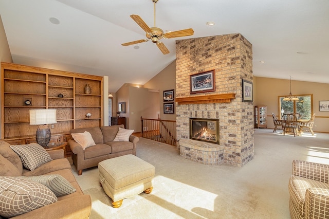 living area with high vaulted ceiling, carpet, and a ceiling fan