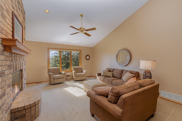 living room with visible vents, a brick fireplace, light carpet, high vaulted ceiling, and a ceiling fan