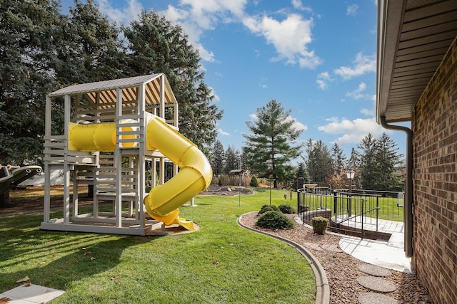 view of playground featuring a lawn