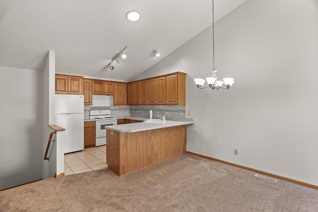 kitchen featuring light carpet, kitchen peninsula, backsplash, decorative light fixtures, and white appliances