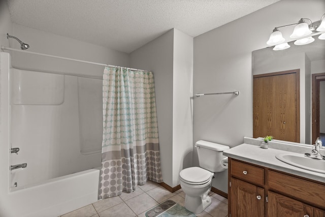 full bathroom with tile patterned floors, vanity, a textured ceiling, shower / tub combo, and toilet