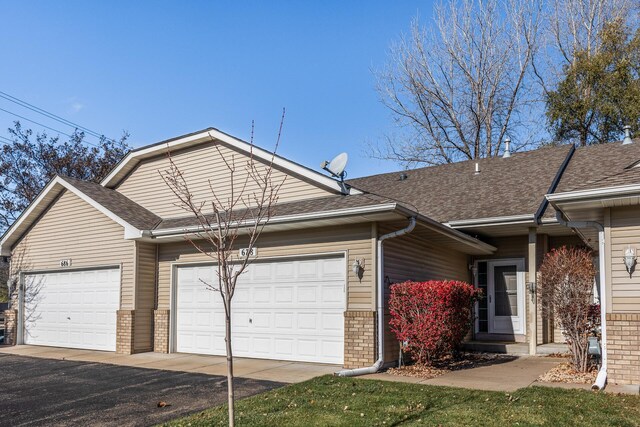 ranch-style home with a garage