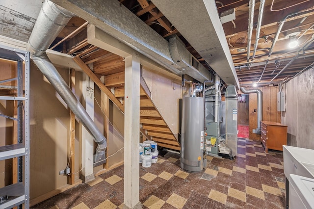 unfinished below grade area featuring heating unit, gas water heater, stairs, electric panel, and tile patterned floors