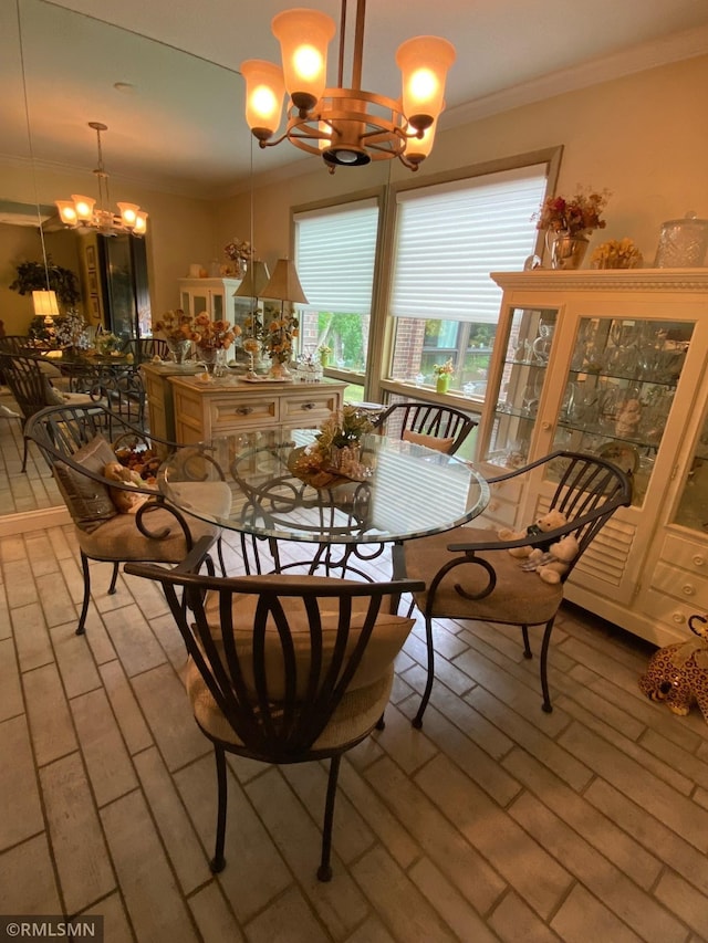 dining room featuring crown molding and a chandelier