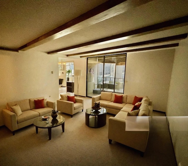 living room featuring carpet, beamed ceiling, and a textured ceiling