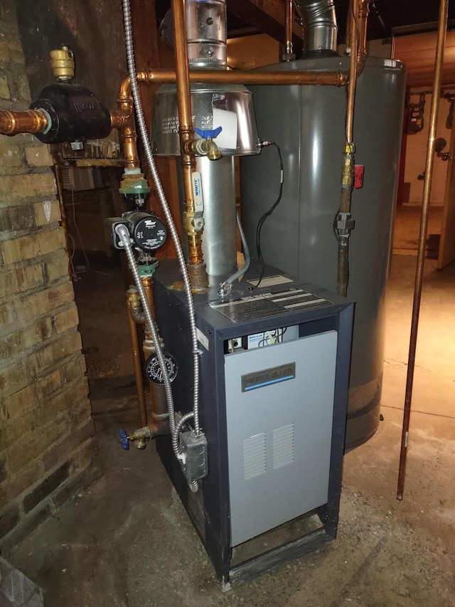 utility room with gas water heater