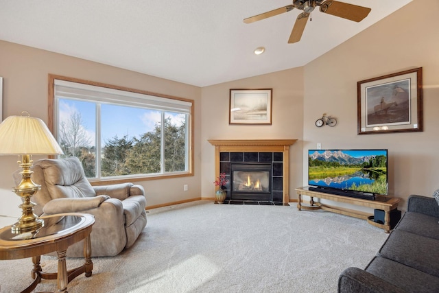 living room featuring carpet, a fireplace, baseboards, and vaulted ceiling