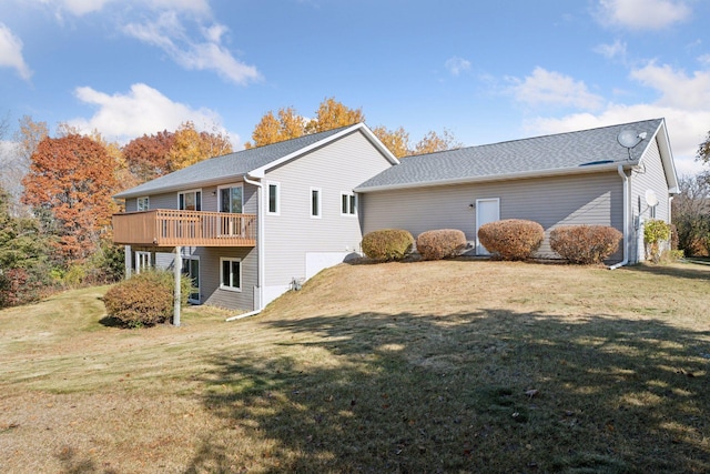 view of side of home featuring a lawn and a wooden deck