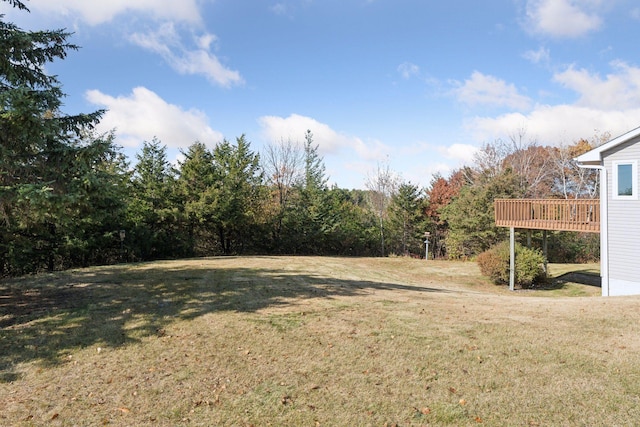 view of yard with a wooden deck