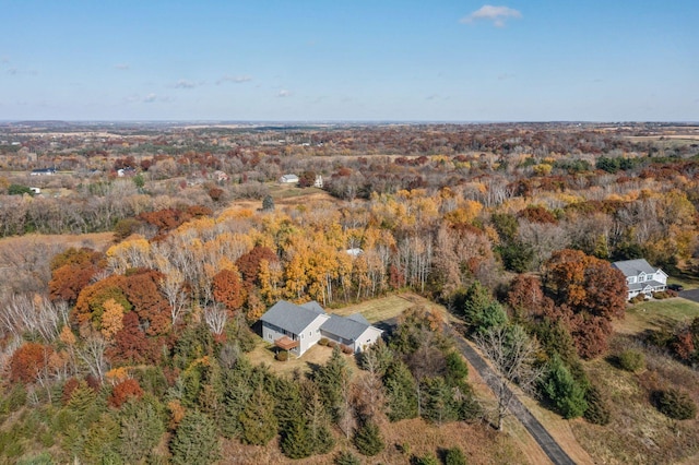 drone / aerial view featuring a view of trees