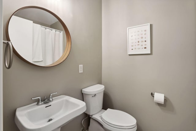 bathroom with toilet and sink