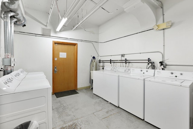 clothes washing area featuring washing machine and clothes dryer