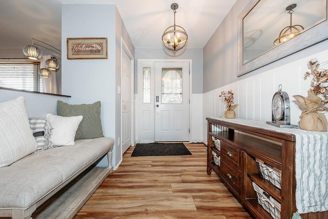 foyer featuring a notable chandelier and light wood-type flooring