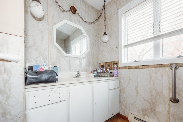 bathroom with vanity, tile walls, and baseboard heating