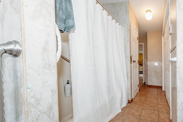 hallway with light tile patterned flooring