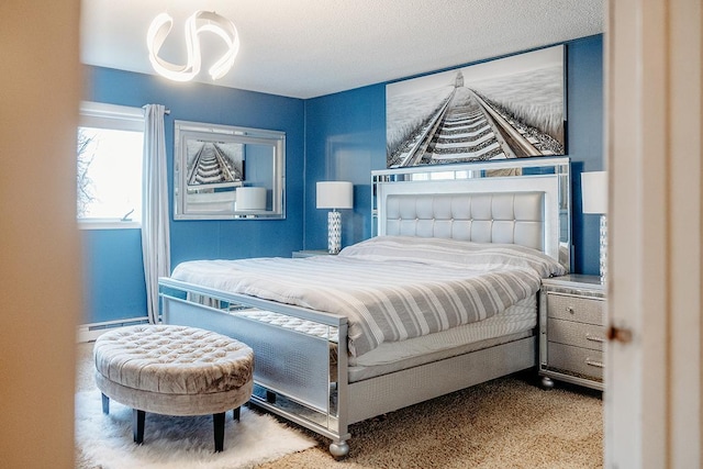 bedroom with a baseboard radiator, carpet flooring, and a textured ceiling