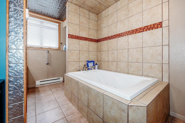 bathroom featuring baseboard heating, tile patterned floors, and tiled tub