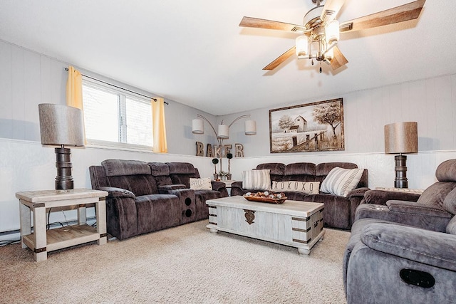 living room featuring ceiling fan and carpet