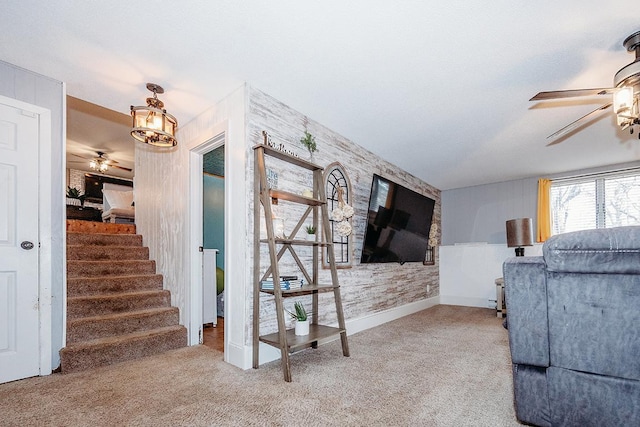 living room featuring ceiling fan and carpet flooring