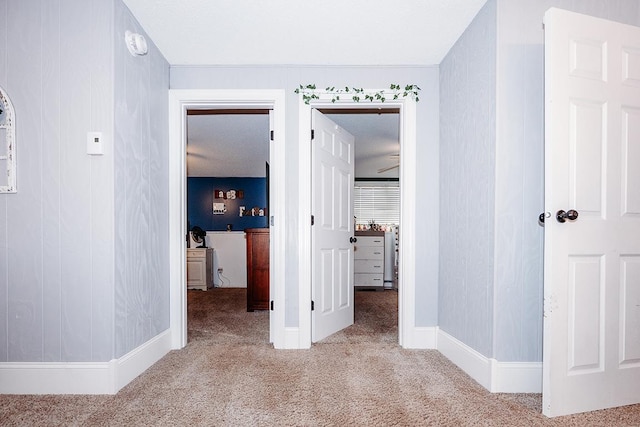 hallway with light carpet