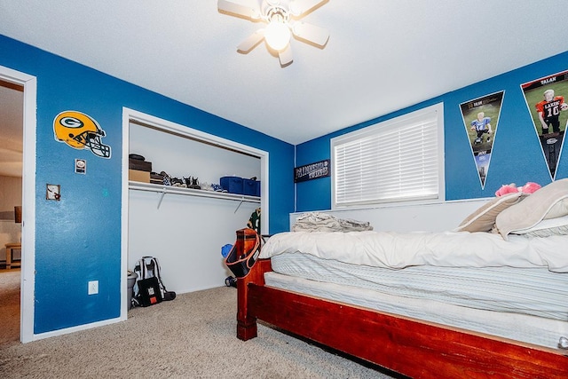 carpeted bedroom featuring a closet and ceiling fan