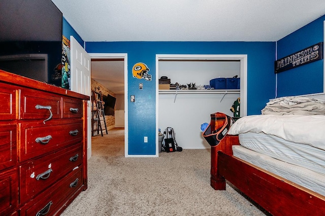 carpeted bedroom featuring a closet