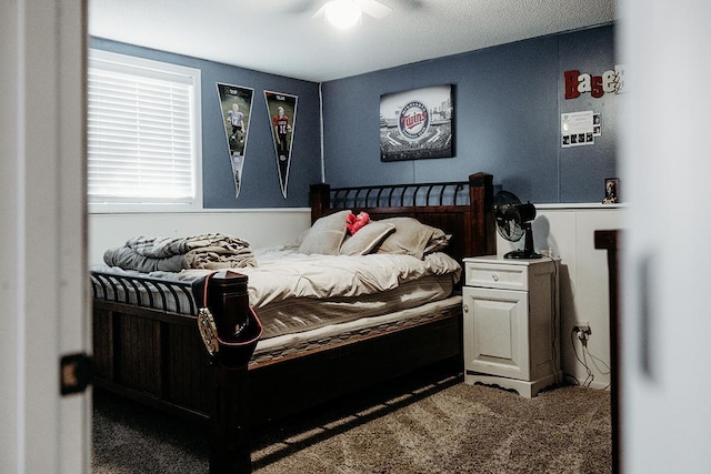 carpeted bedroom with ceiling fan