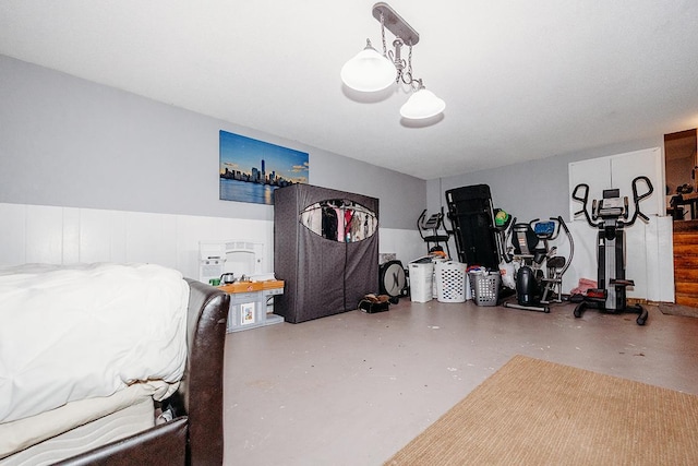 bedroom featuring concrete floors