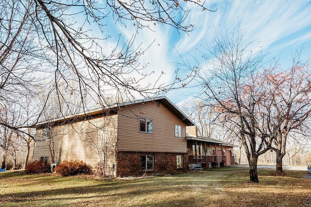 view of home's exterior featuring a lawn