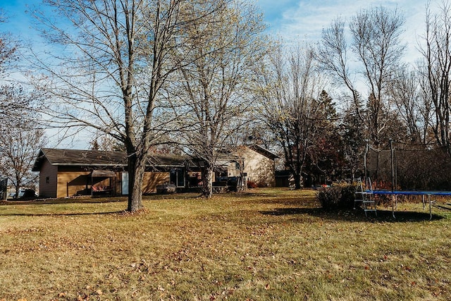 view of yard featuring a trampoline