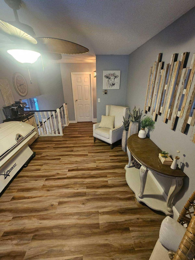 sitting room featuring hardwood / wood-style flooring and a textured ceiling