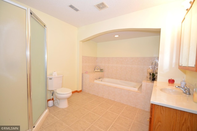 961 113th Ave NE, Blaine, MN 55434 - full bathroom with vanity, a shower stall, tile patterned floors, and a garden tub