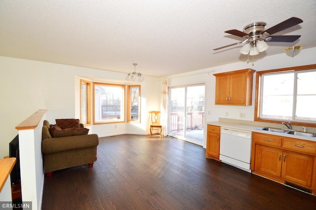 961 113th Ave NE, Blaine, MN 55434 - kitchen with white dishwasher, dark wood finished floors, light countertops, brown cabinetry, and a textured ceiling