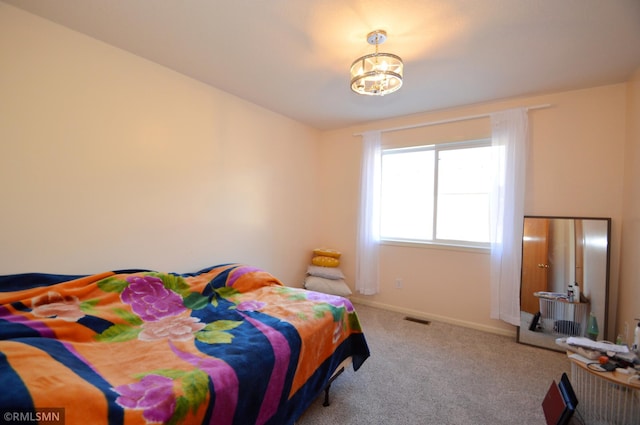 bedroom featuring light carpet