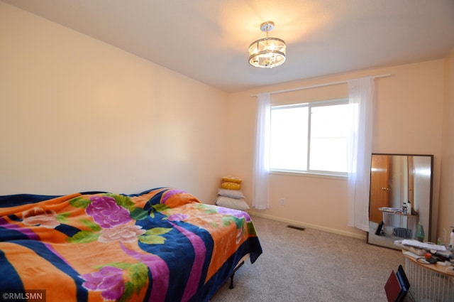 961 113th Ave NE, Blaine, MN 55434 - carpeted bedroom with baseboards and a chandelier
