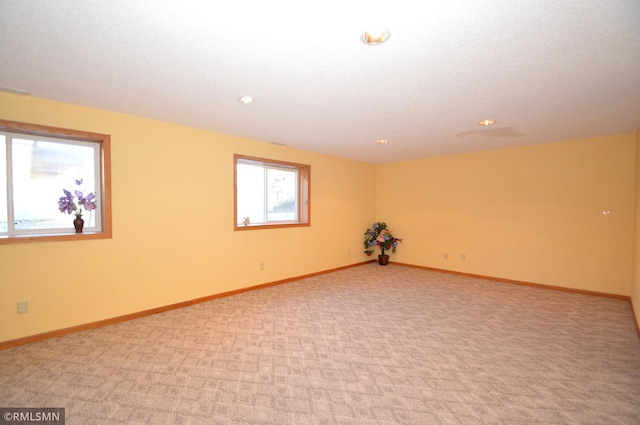 961 113th Ave NE, Blaine, MN 55434 - spare room with recessed lighting and light carpet