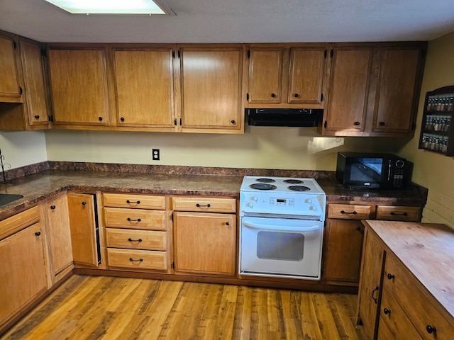 kitchen featuring extractor fan, white electric range, and light hardwood / wood-style floors