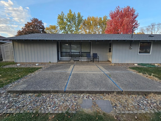 back of house with a patio