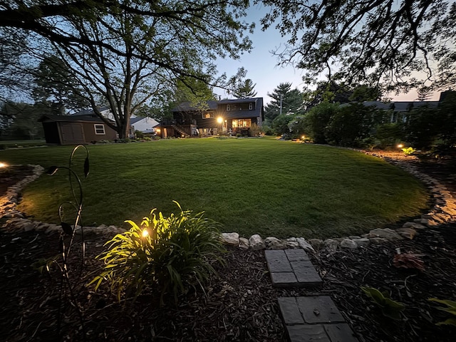 yard at dusk with a shed