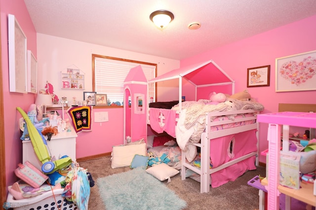 bedroom featuring a textured ceiling and carpet