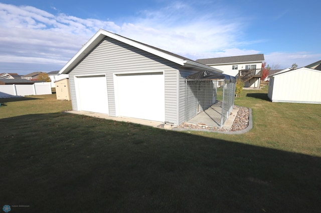 garage featuring a yard