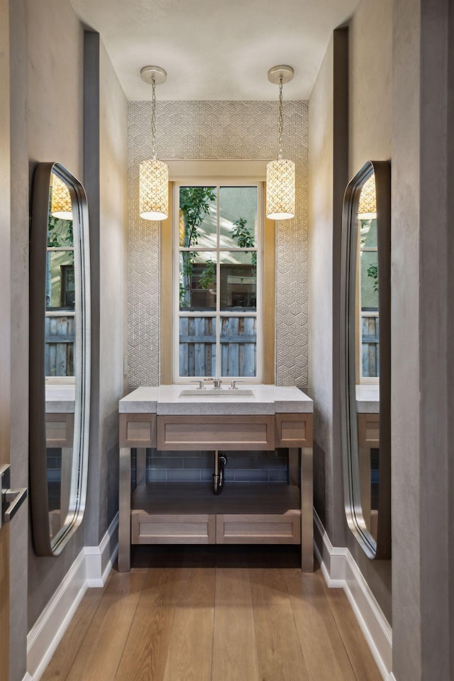 bathroom with vanity and wood-type flooring