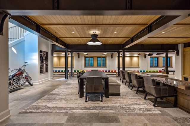 recreation room featuring wood ceiling and beamed ceiling