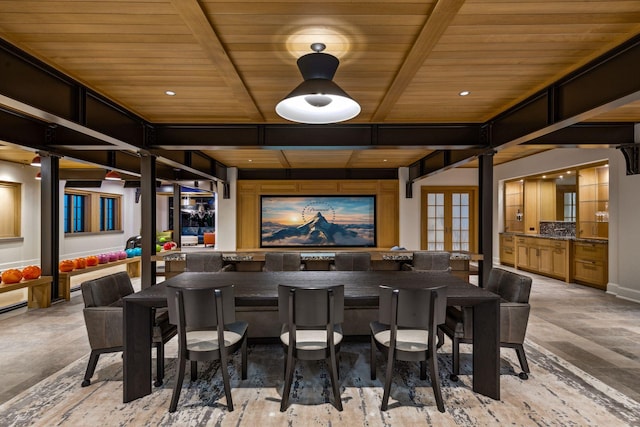 interior space with french doors, wooden ceiling, and decorative columns