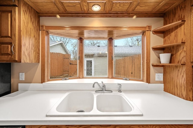 kitchen featuring sink, wooden ceiling, and a wealth of natural light