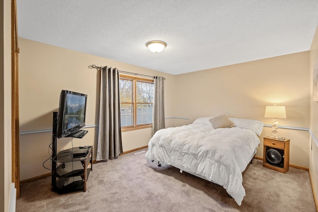 carpeted bedroom with a textured ceiling