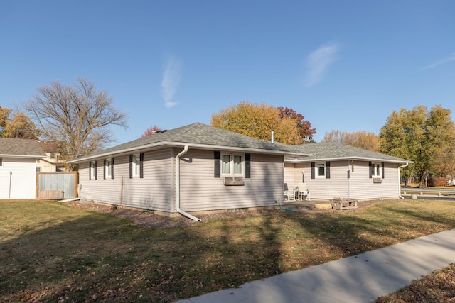 view of front facade featuring cooling unit, a front lawn, and a patio area