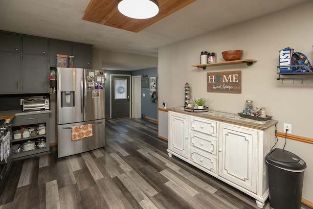 kitchen with gray cabinets, stainless steel refrigerator with ice dispenser, and dark hardwood / wood-style floors